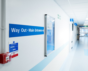 way out main entrance hospital corridor signage directions